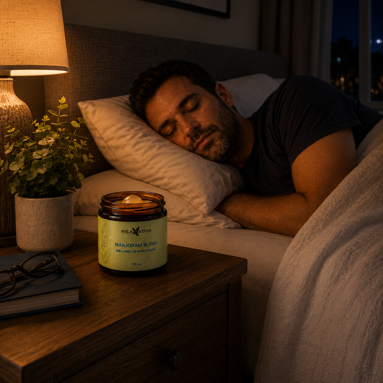 Man sleeping peacefully beside Relaxation Island Marjoram Blend aromatherapy jar