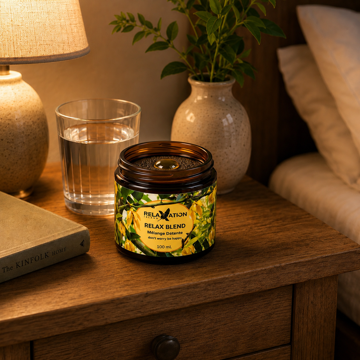 Relax Blend aromatherapy jar on a bedside table beside a bed for a calming bedtime routine
